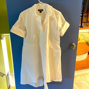 Clean casual dress has pockets and lightweight. It’s longer in the back.